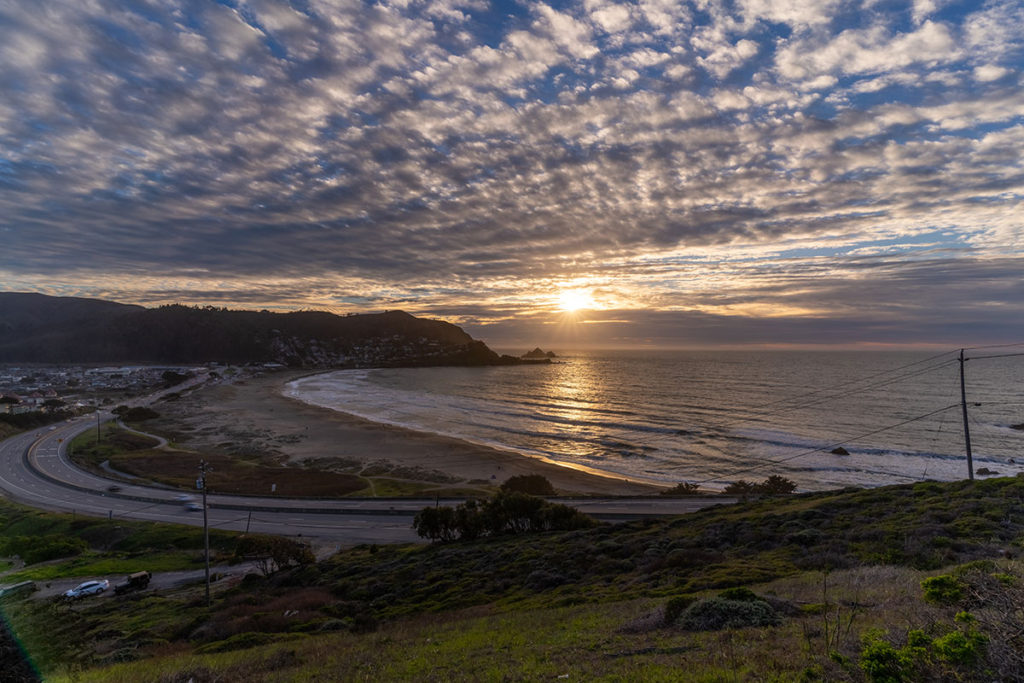 Sunset with dramatic clouds at Linda Mar beach, walking distance to Anchor Inn Pacifica.